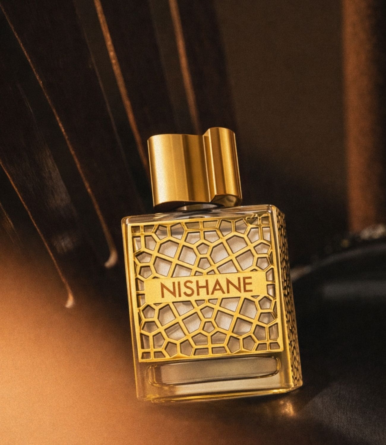 Nishane Hacivat Oud extrait in warm lighting
