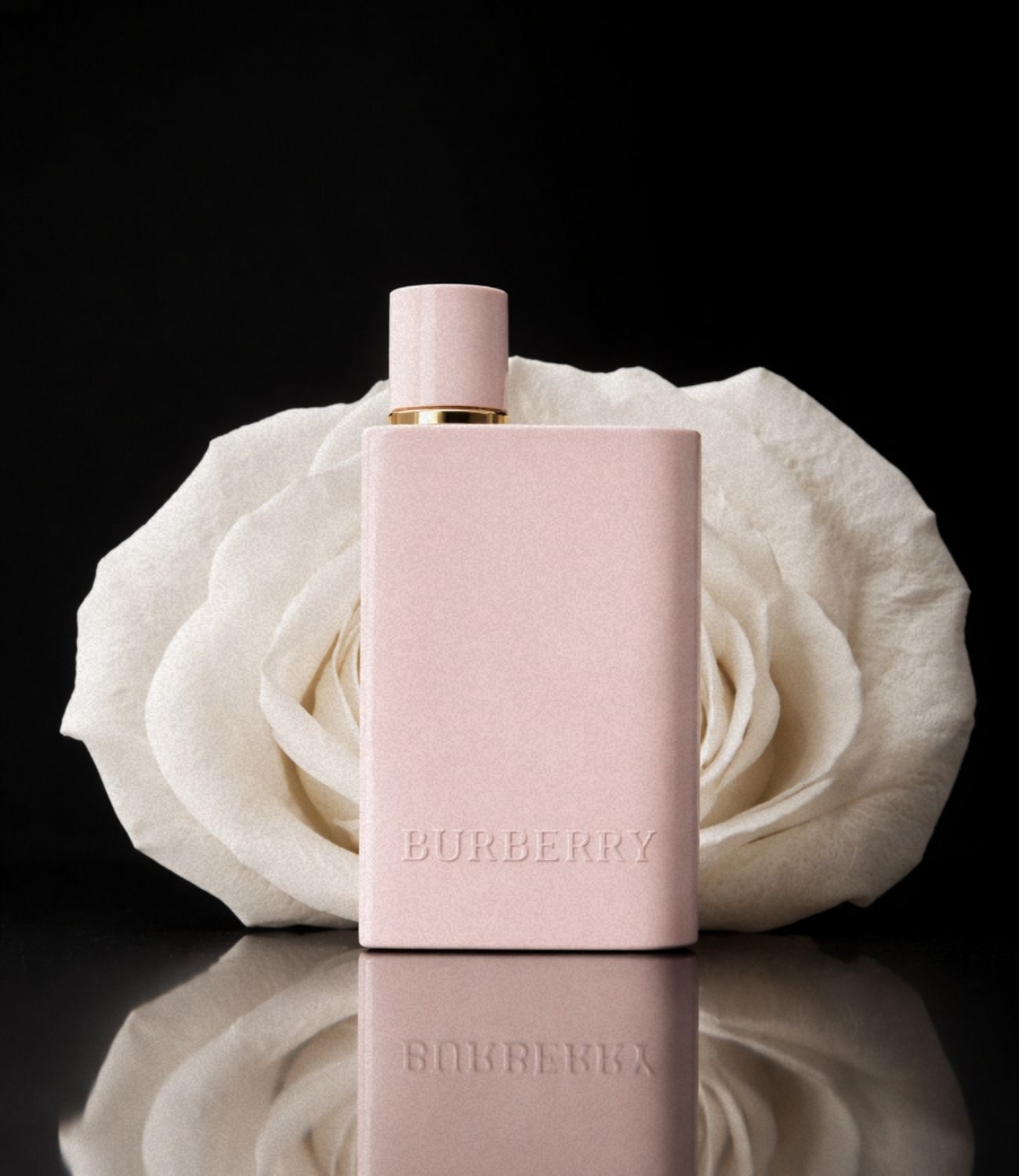Burberry Her Elixir bottle with white rose backdrop